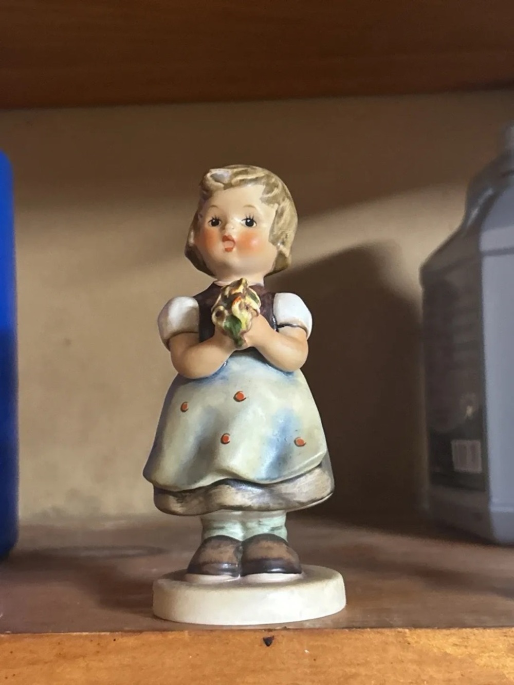 Hummel Cream, Blue and Brown Girl Figurine Holding Flowers
